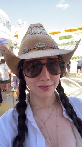 Woman takes selfie at Las Vegas pool party