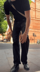 All-black look with crossbody bag on a London sidewalk