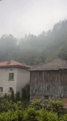 Heavy rain blankets rural village with misty conditions