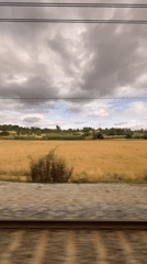 Train passenger films rural Spanish countryside near Granollers