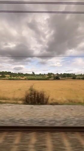 Train passenger films rural Spanish countryside near Granollers