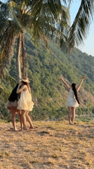 Women in white dresses photoshoot in tropical Đà Nẵng setting