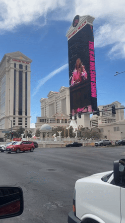 Evening street views capture Caesars Palace, Nike billboard in Paradise