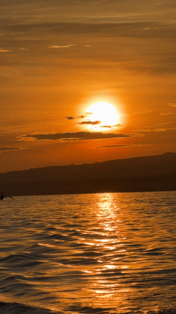 Sunset observed over water in Banjar, Indonesia