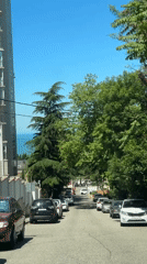 Coastal road filmed descending toward sea in Sochi