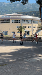 Women exercise in spring boots on Budva courts