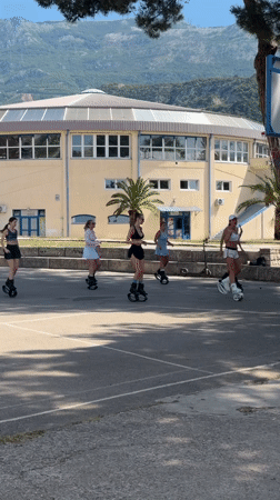 Women exercise in spring boots on Budva courts