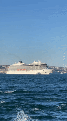 Cruise ship Viking Saturn sails Bosphorus as onlookers gather