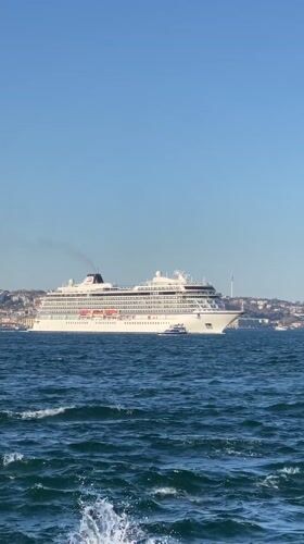 Cruise ship Viking Saturn sails Bosphorus as onlookers gather