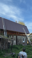 Roofing crew repairs wooden buildings in Perm, Russia