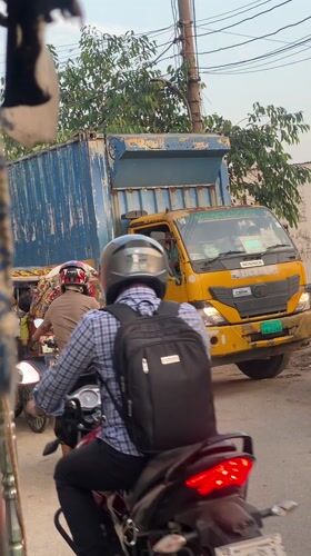 Street traffic and delivery activity observed in Dhaka