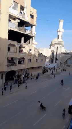 Residents gather in war-damaged Khan Yunis streets