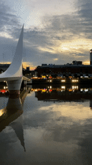 Buenos Aires waterfront panorama captures modern bridge, city reflections