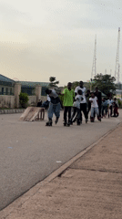 Youth rollerblading group practices on Jos streets during evening hours