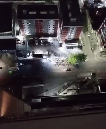 Night gathering observed at Caracas intersection amid high-rises