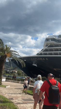 Tourists explore historic Kotor as cruise ship docks, stage prepared