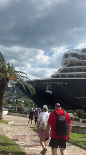 Tourists explore historic Kotor as cruise ship docks, stage prepared