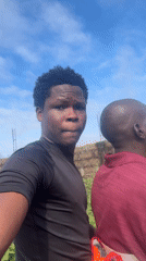 Running and candid moments on a dirt road in Ihiagwa
