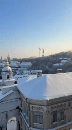 Snow blankets historic Kyiv monastery complex under clear skies