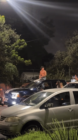 Vehicles roll through Mexico City streets in late-night celebration