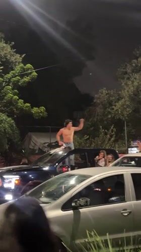 Vehicles roll through Mexico City streets in late-night celebration