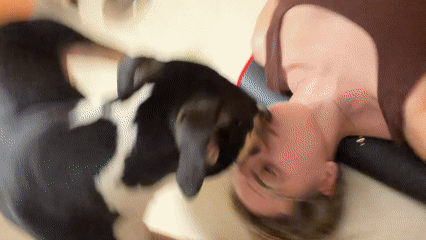 Woman and dog share quiet indoor moment in Tel Aviv