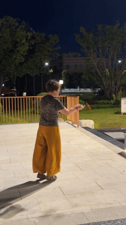 Outdoor fan dancing and nighttime plaza life in Yiwu