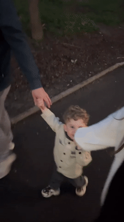 Family enjoys evening outing at riverside park in Klin