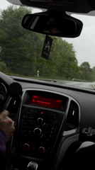 Driver navigates wet roads in Lovech, Bulgaria evening