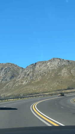 Driver records highway journey through Cape Town during midday