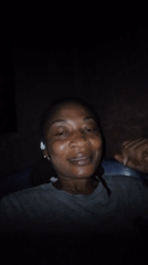 Indoor close-up series, grey tee and white earbuds, camera-facing