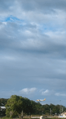 Aircraft lands at Baan Chaweng airport during cloudy weather
