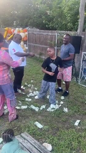 Arlington backyard birthday party features money-throwing game for children