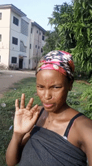 Woman records selfies with baby in Keffi, Nigeria