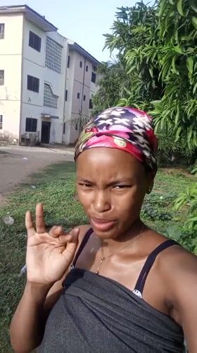 Woman records selfies with baby in Keffi, Nigeria