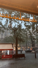 Heavy rain soaks Barcelona streets, witnessed from indoors