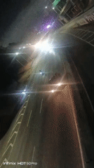 Nighttime urban scenes documented across Caracas highways and intersections