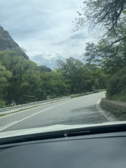 Morning traffic navigates mountain road near Rila Bulgaria