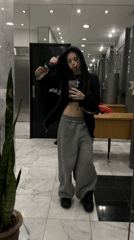 Young women photographed taking selfies in Buenos Aires building