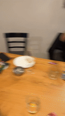 Evening apartment gathering in Sofia features food, drinks