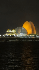 Nighttime waterfront cityscape captured in Xiangzhou, China