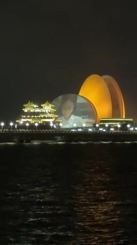 Nighttime waterfront cityscape captured in Xiangzhou, China