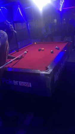 Night out at a Nigerian bar: pool, grilled food, neon lights