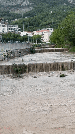 Muddy river flows through Donji Pobori, Montenegro dams