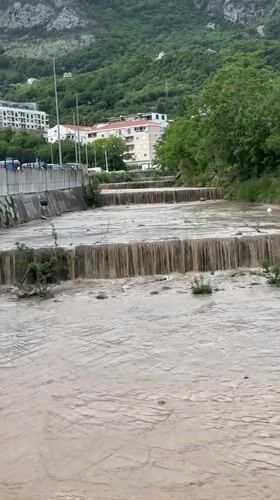 Muddy river flows through Donji Pobori, Montenegro dams