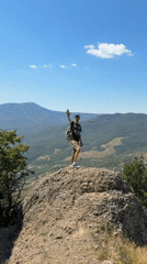 Rocky summit views across a sweeping Ukrainian mountain landscape