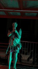 Street musician performs evening balcony concert in Da Nang