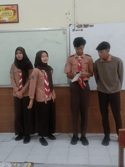 Students in scout uniforms during a classroom session in Kediri