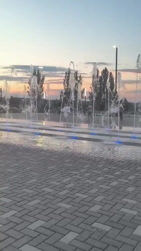 Fountain square in Alchevsk comes alive at dusk