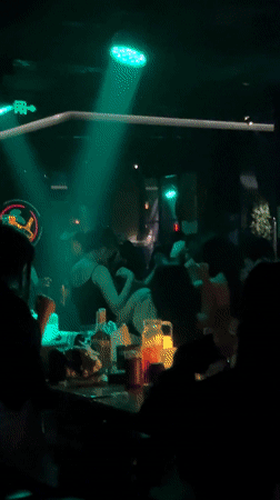 Woman takes mirror selfies in Liangjiang public restroom